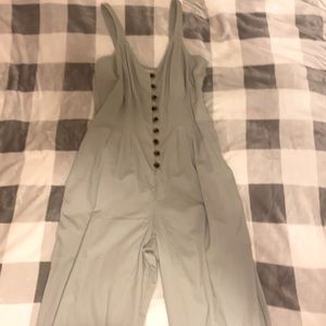 Very cute grey jumpsuit from Universal Thread with functional brown buttons.